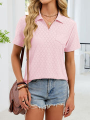 Blush pink eyelet polo collar blouse with short sleeves and a chest pocket.