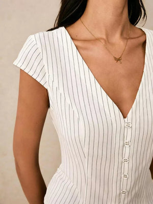 White pinstripe V-neck buttoned shirt with short sleeves.