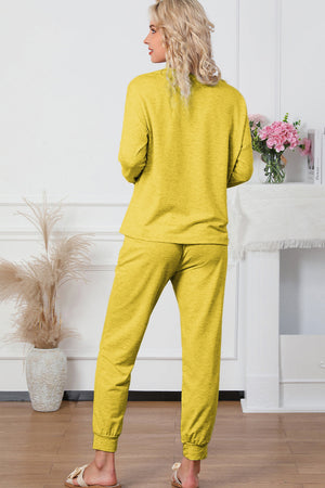 Plush lounge set in True Yellow, featuring relaxed fit joggers with cuffed ankles and a long-sleeve top.