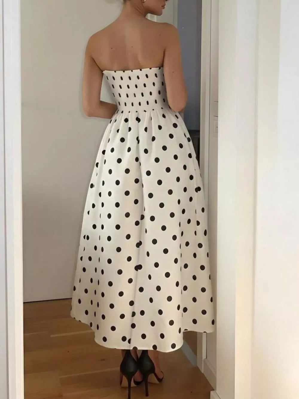 Charming polka dot strapless midi dress in cream polyester with A-line cut.