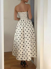 Charming polka dot strapless midi dress in cream polyester with A-line cut.