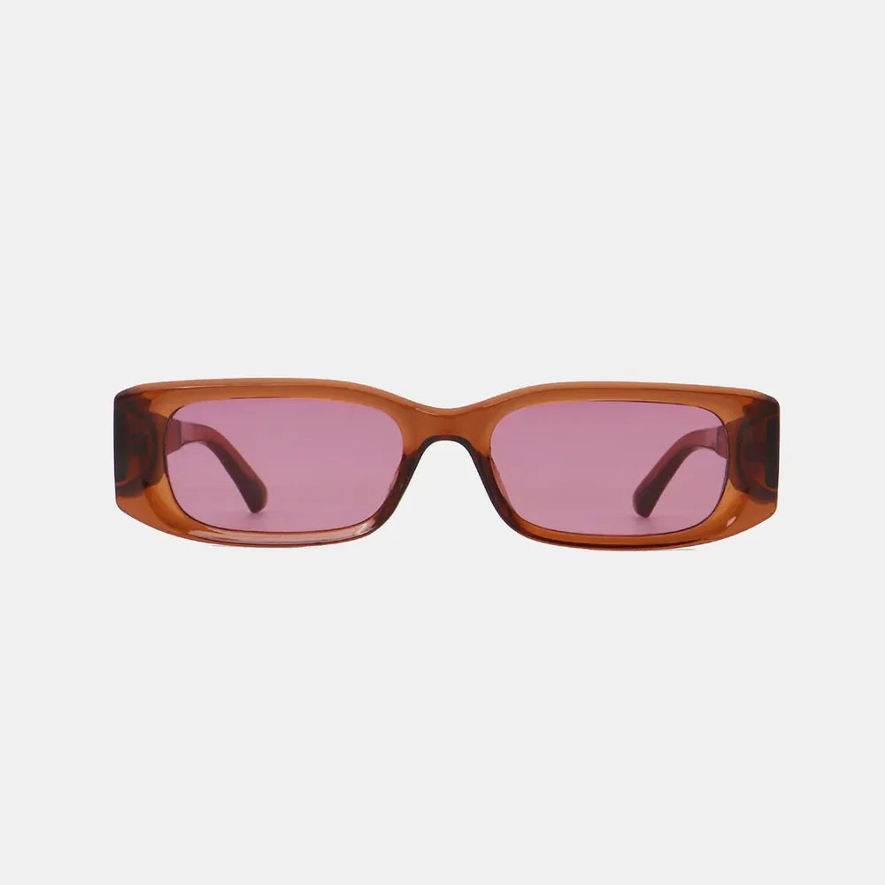 Chunky rectangular sunglasses in caramel with pink lenses and bold frames.