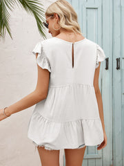 White babydoll blouse with ruffled sleeves, tiered hem, and keyhole back detail.