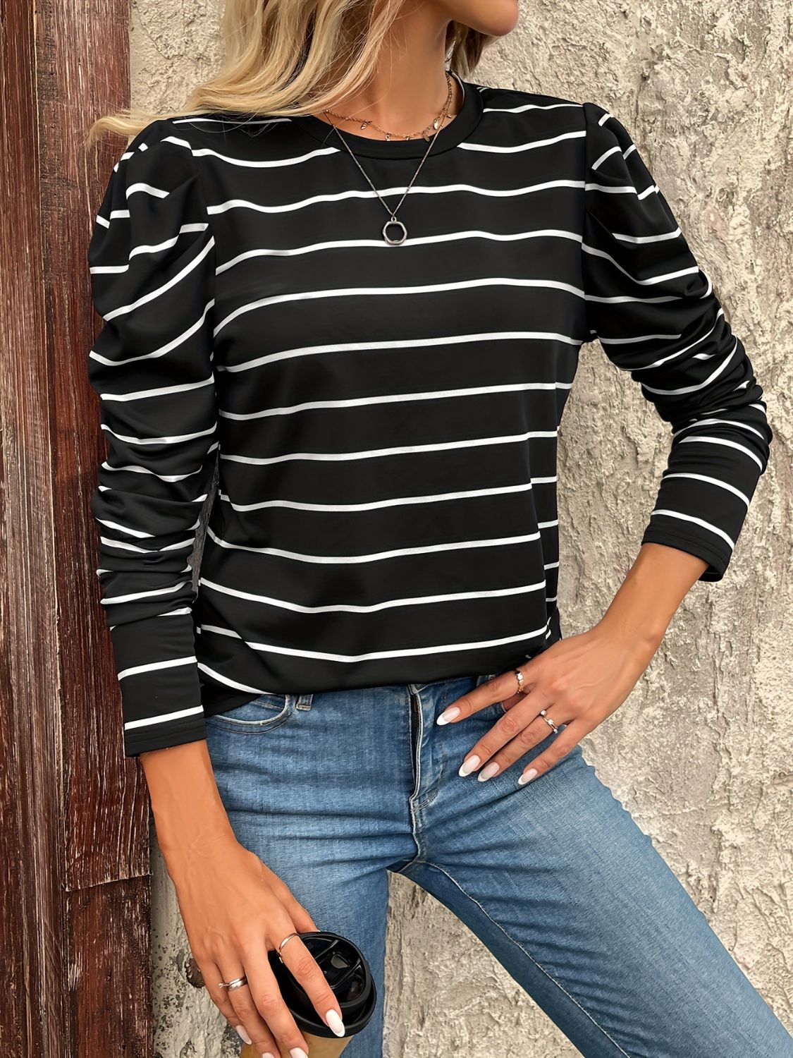 Black and white striped long sleeve top with gathered puff sleeves.