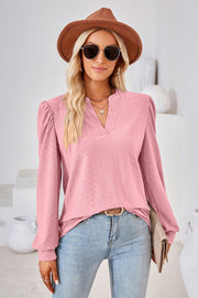 Pink textured blouse with bishop sleeves and v-neck