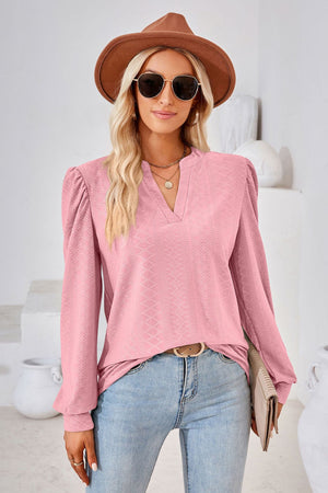 Pink textured blouse with bishop sleeves and v-neck