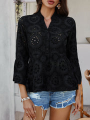 Black eyelet embroidered peplum blouse with ruffled sleeves and button front.