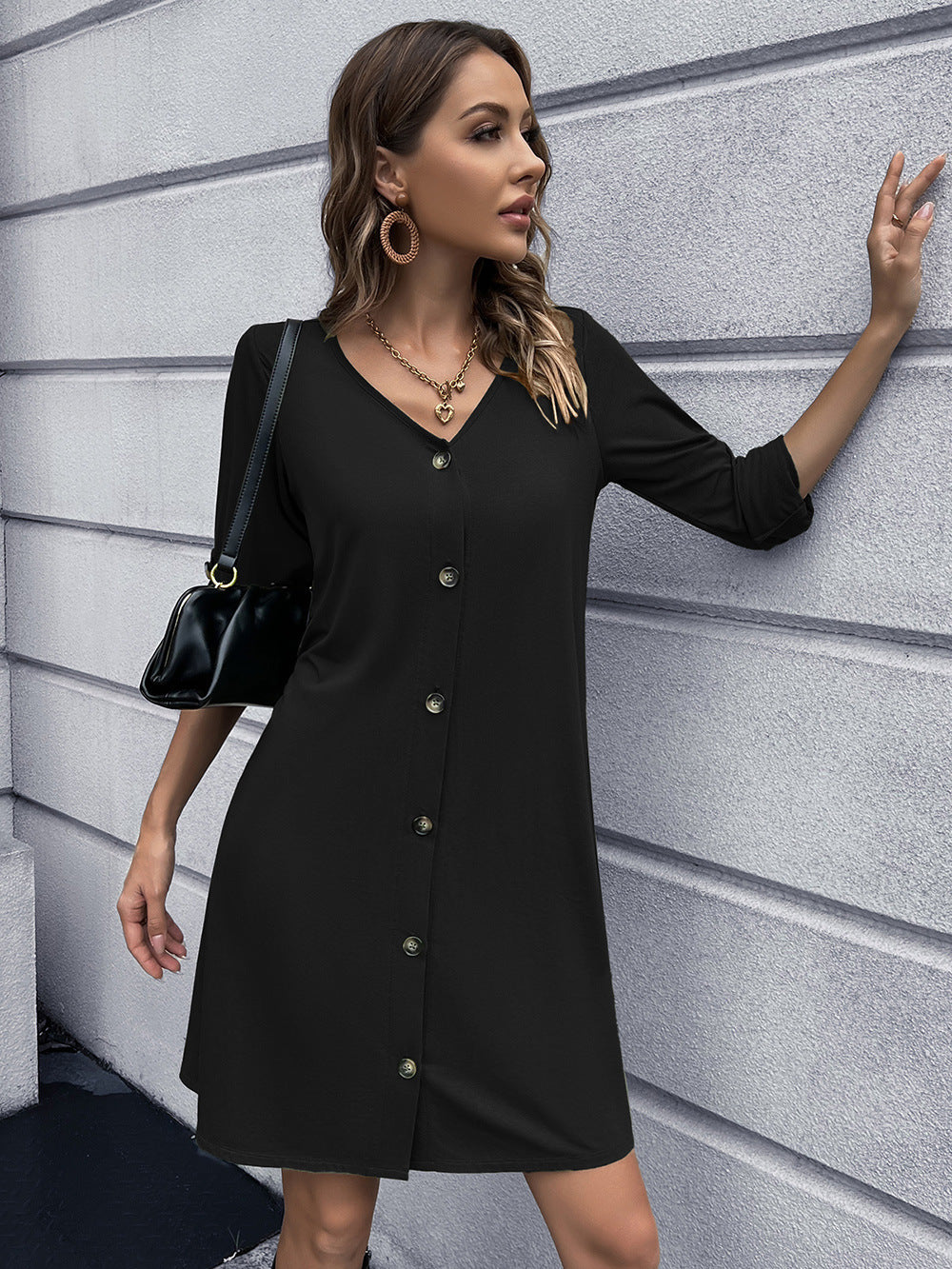 Black button-down mini dress with V-neck and 3/4 sleeves.