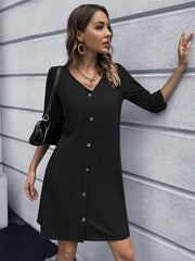 Black button-down mini dress with V-neck and 3/4 sleeves.