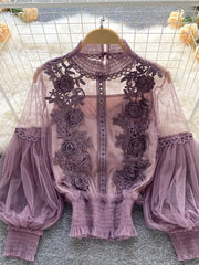 Purple lace blouse with floral embroidery and sheer puff sleeves, paired with a cami.