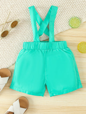 Turquoise cotton suspender shorts with elastic waistband and pockets.