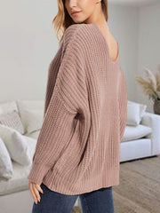 Dusty Pink ribbed knit sweater with batwing sleeves and a deep scoop neckline.