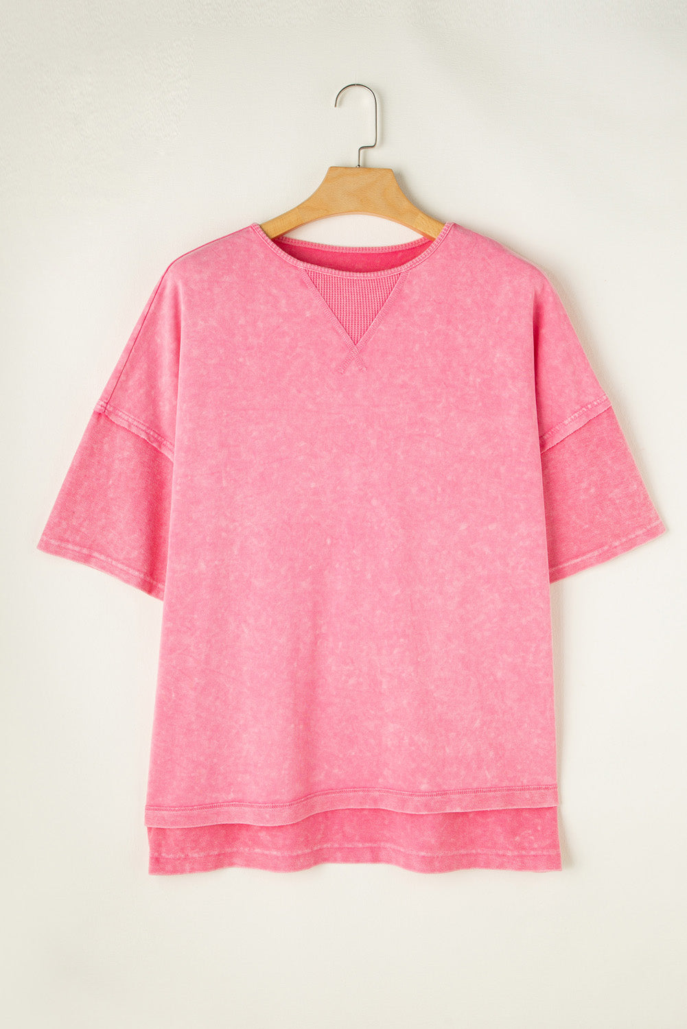 Pink acid wash tee with layered sleeves and V-stitch neckline detail.
