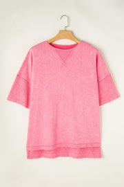 Pink acid wash tee with layered sleeves and V-stitch neckline detail.