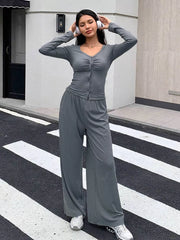 Gray button-down ruched top and wide-leg pants set with V-neck and long sleeves.