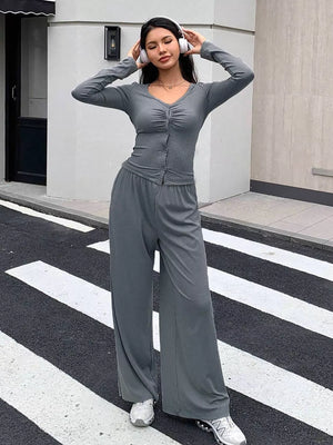 Gray button-down ruched top and wide-leg pants set with V-neck and long sleeves.