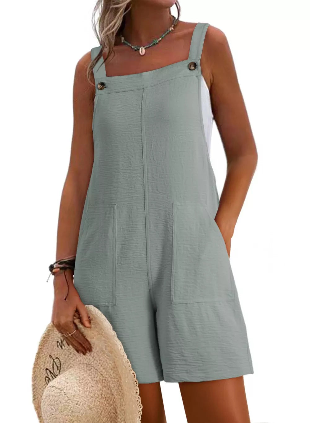 Light green textured romper with square neck, button straps, and patch pockets.