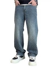 Relaxed fit denim jeans with allover textured pattern and faded wash.