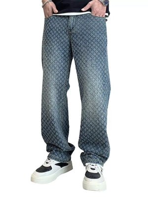 Relaxed fit denim jeans with allover textured pattern and faded wash.