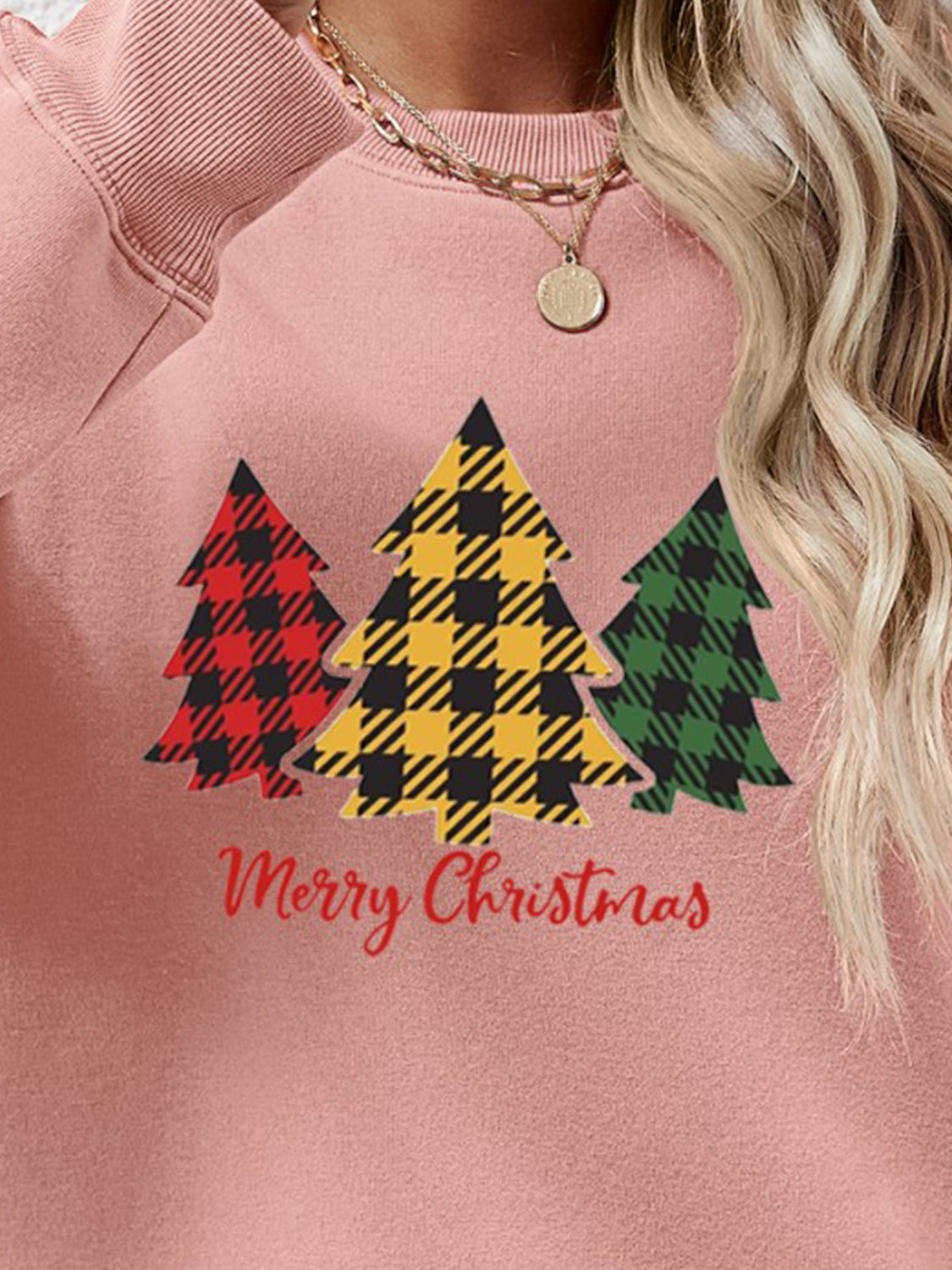 Plaid tree graphic crewneck sweatshirt in blush pink with Merry Christmas text.