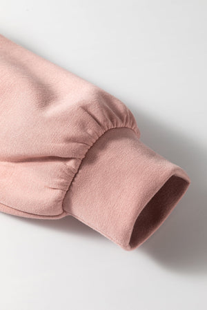 Dusty pink cardigan sleeve with gathered detail and ribbed cuff