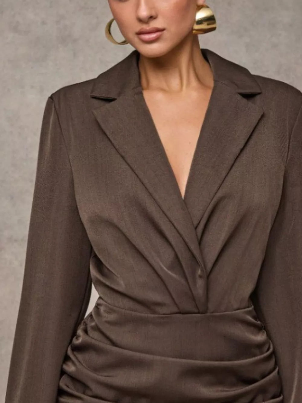 Brown ruched blazer dress with a deep V-neck and long sleeves.