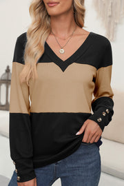 Contrast panel v-neck sweater in black and khaki with button cuff details.