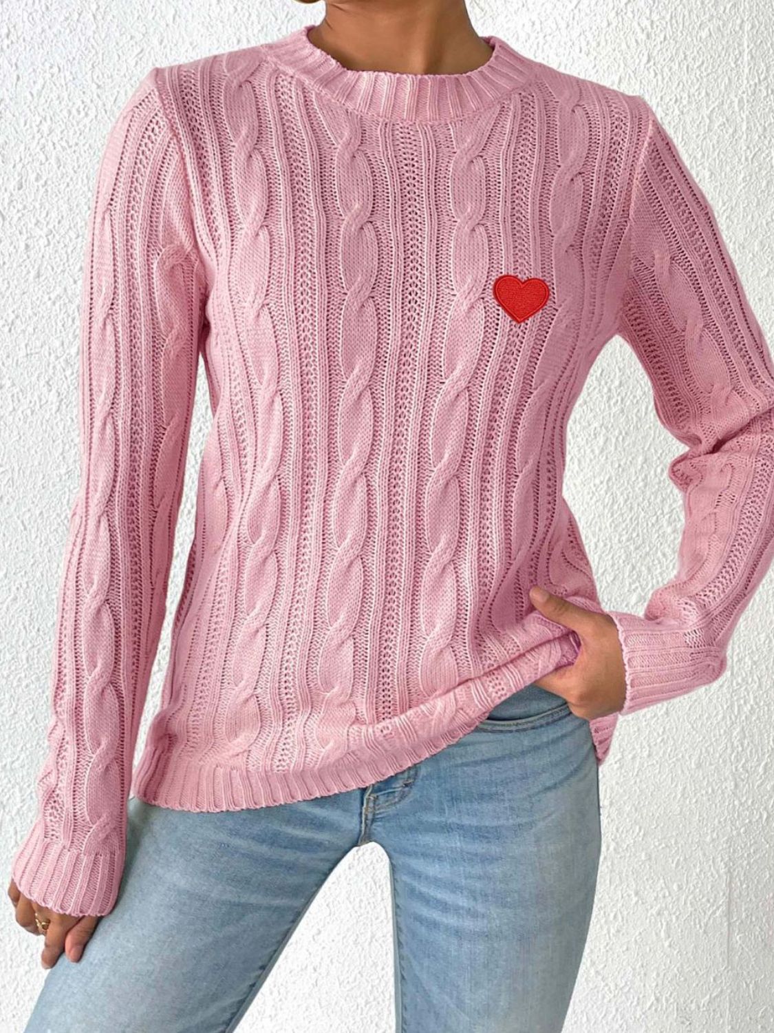 Dusty pink cable knit sweater with embroidered red heart detail