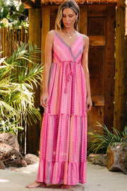 Pink chevron stripe tiered maxi dress with V-neck and tie waist.