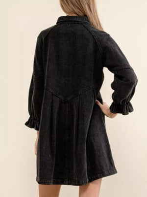 Black denim button-down dress with ruffled cuffs and a cinched waist detail.