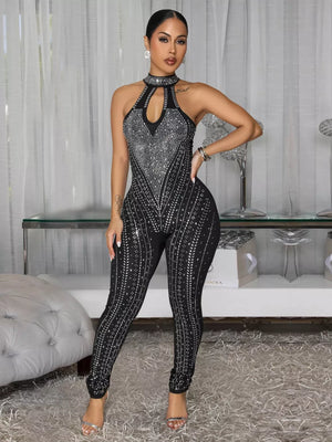 Black rhinestone halter neck romper with cutout and full length legs.