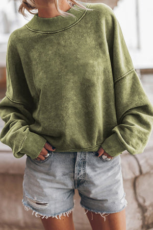 Moss acid wash mock neck sweatshirt with ribbed cuffs and hem.