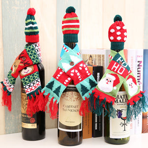 Holiday knit bottle dresses with Santa, reindeer, and candy cane designs.