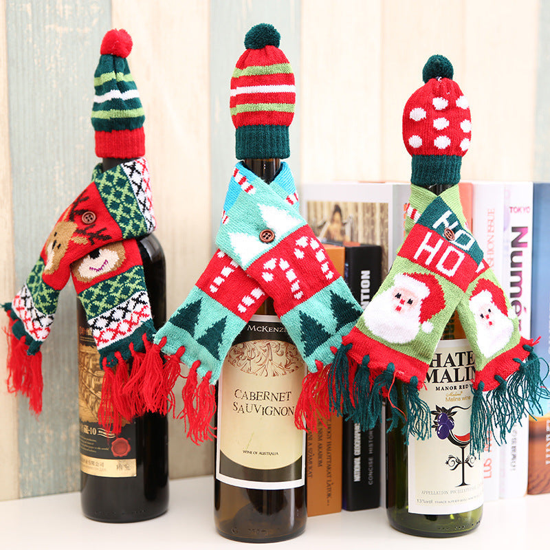 Holiday knit bottle dresses with Santa, reindeer, and candy cane designs.
