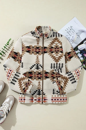 Southwestern quilted zip-up jacket in eggshell with geometric pattern, mock neck, and zippered pockets.