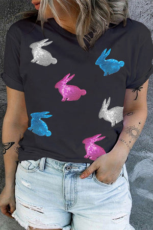 Black crewneck tee with sequin bunny appliqués in silver, blue, and pink.