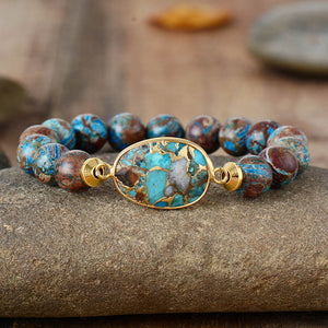 Aqua and brown beaded bracelet with gold oval stone centerpiece