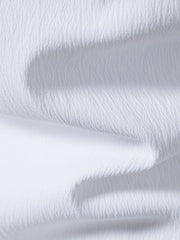 White cotton short sleeve shirt with textured fabric and band collar detail.