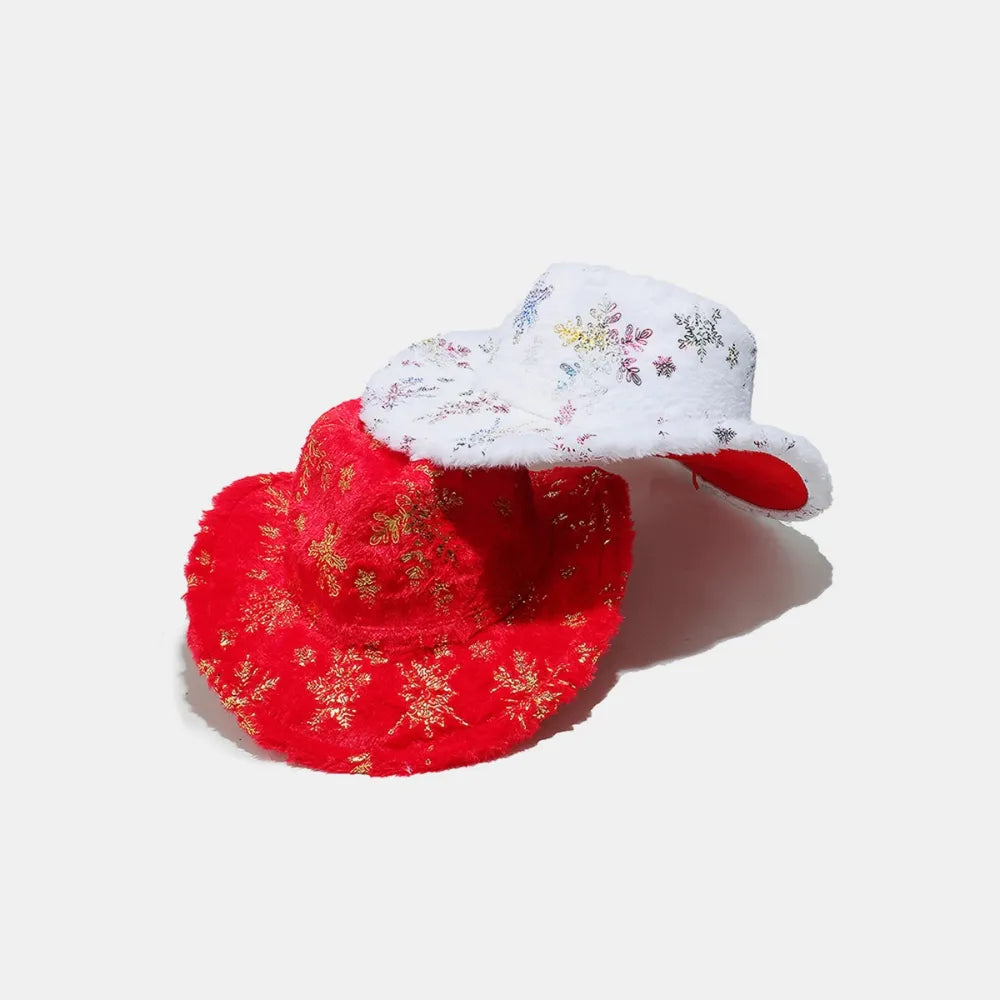 Crimson faux fur cowboy hat with gold snowflake pattern and white faux fur hat with colorful snowflake pattern.