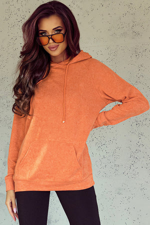 Orange textured raglan sleeve hoodie with drawstring and front pocket.