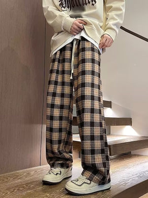 Men's vintage plaid wide leg trousers in apricot and black with a drawstring waist.