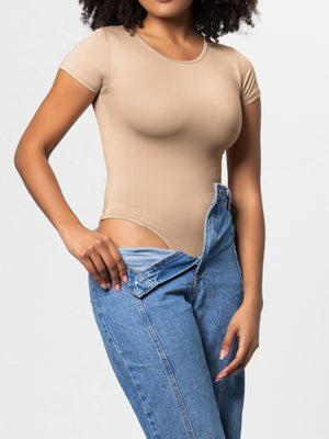 Tan short-sleeve scoop-neck bodysuit shown with jeans.