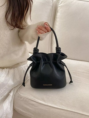 Drawstring Bucket Crossbody Bag in Black, front view