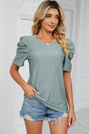 Perforated puff sleeve top in light green with a diamond pattern, crew neck, and short sleeves.