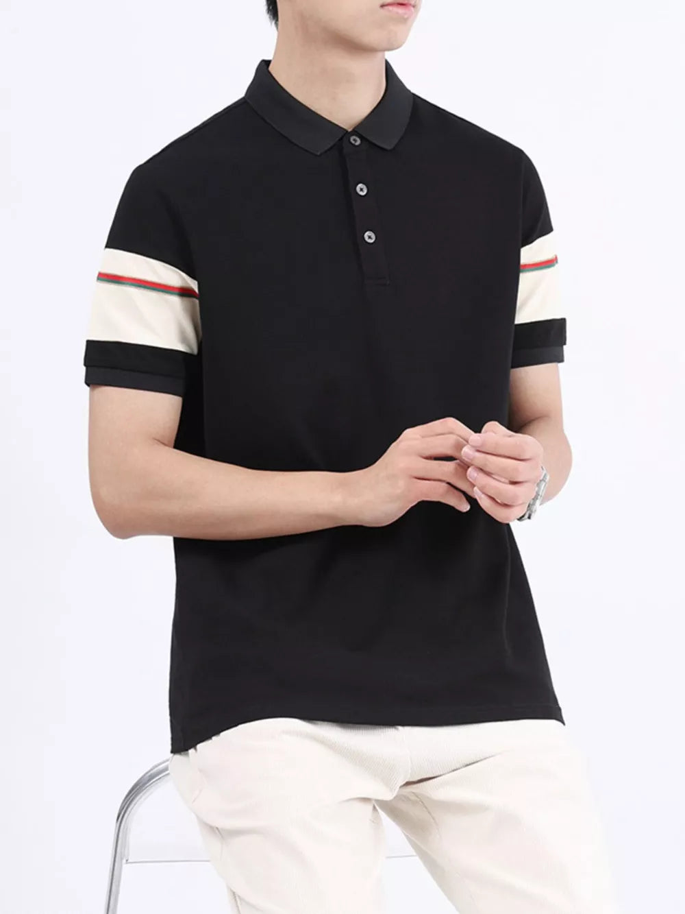 Black combed cotton polo with striped sleeve accents