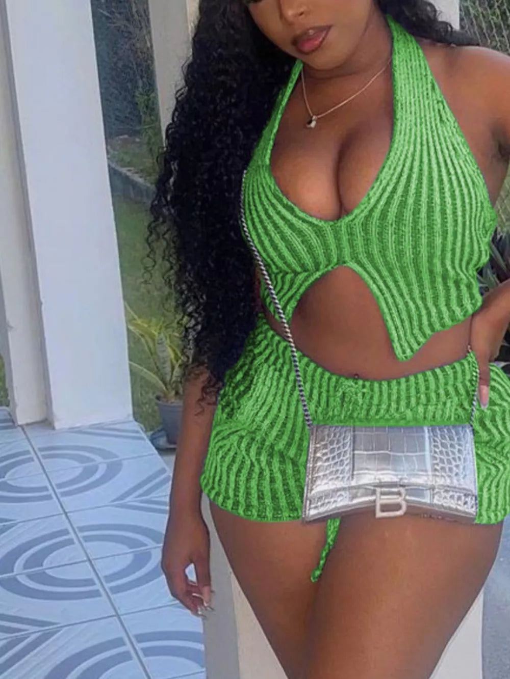 Green ribbed knit halter top and shorts set with cut-out detail