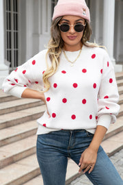 White polka dot knit sweater with balloon sleeves and crew neck.