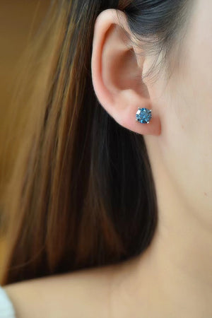 Sapphire Brilliance Platinum Stud Earrings with bright blue stones.