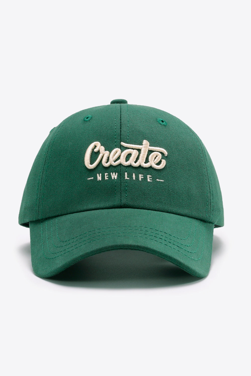 Green baseball cap with embroidered "Create - New Life" text