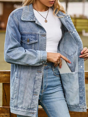 Relaxed fit washed denim trucker jacket in medium blue with button front and chest pockets.